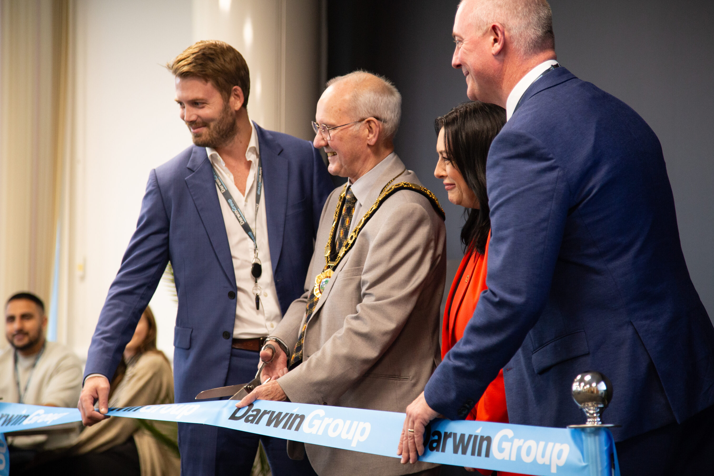 The Darwin Group CEO, Richard Pierce, and Deputy CEO, Jim Pierce stand alongside the Telford & Wrekin Council mayor and Councillor Eileen Callear during the ribbon cutting ceremony.
