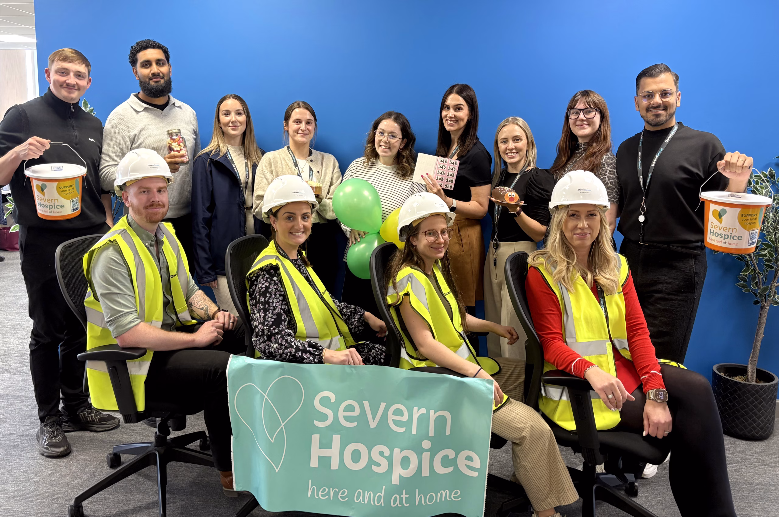 The Darwin Group team, some wearing high-vis vests and hard hats