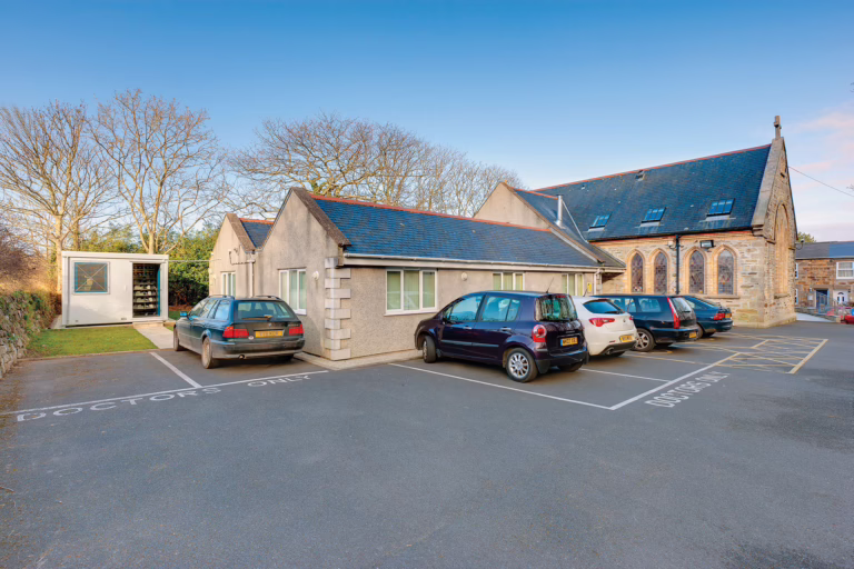 Exterior of a GP surgery. The external storage space is located off to the left.