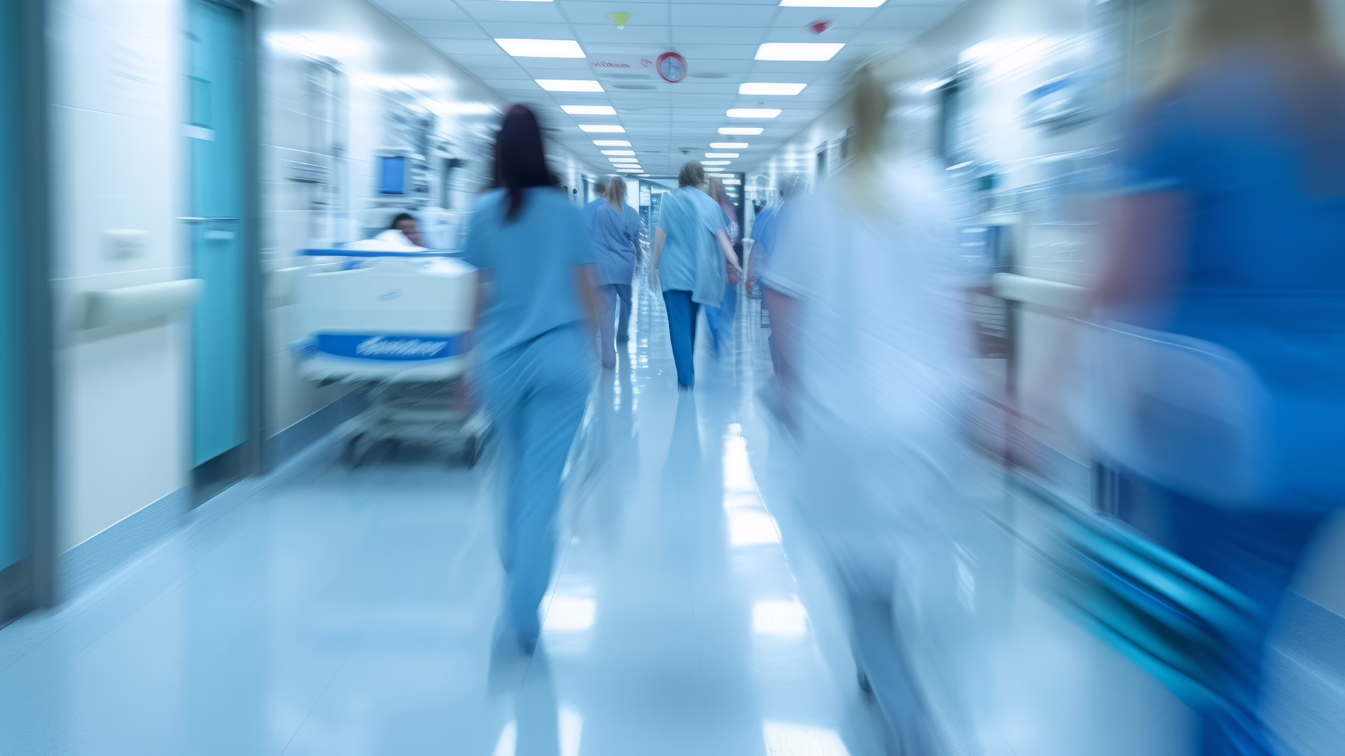 Doctors and medical staff walk down in hospital, Busy corridor in medical clinic with motion blur effect